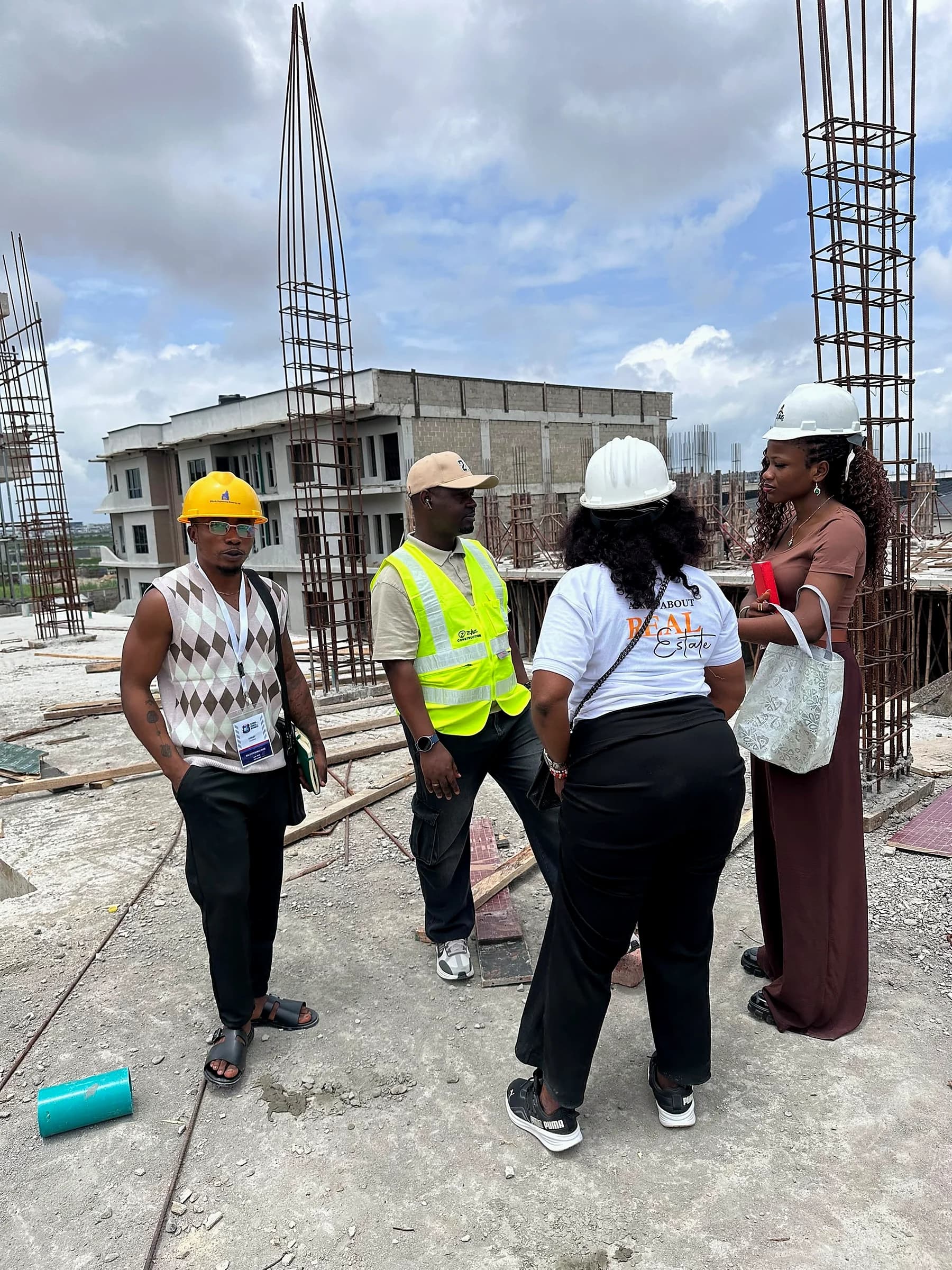 Tahnwi Lesley speaking with a team during a construction-site visit